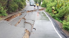 Vehicle access was blocked off and a house was condemned after a 20m section of road slumped. Photo/Supplied