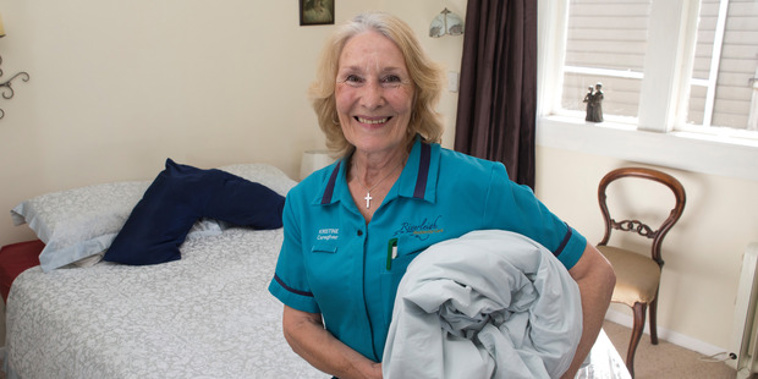 Rest home caregiver Kristine Bartlett's pay will go from about $16 an hour to about $23 (Mark Mitchell).