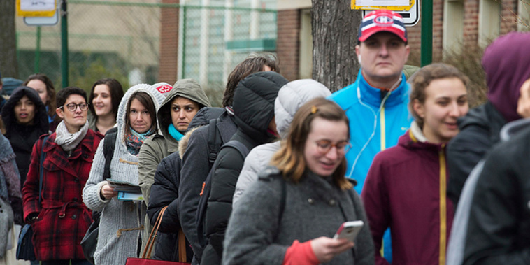French expats wait in line to vote in Montreal, Canada today. (AP)
