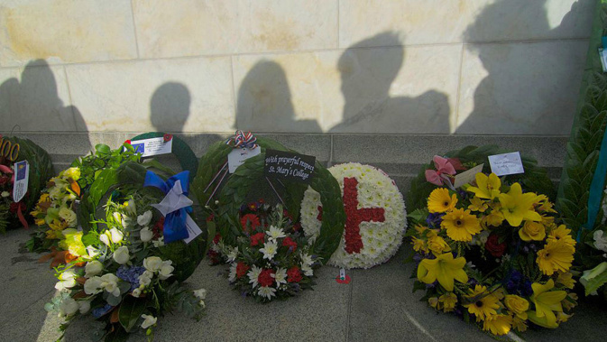 Activists protested at a dawn service and wreath laying ceremony in Wellington this morning. (Getty)