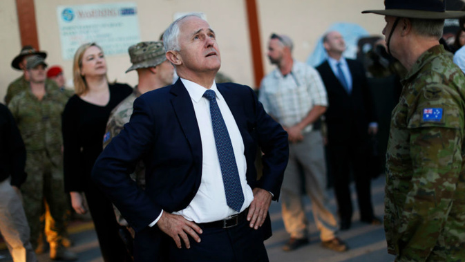 Australia's PM Malcolm Turnbull watches a helicopter passing overhead in Kabul, Afghanistan. (Getty)