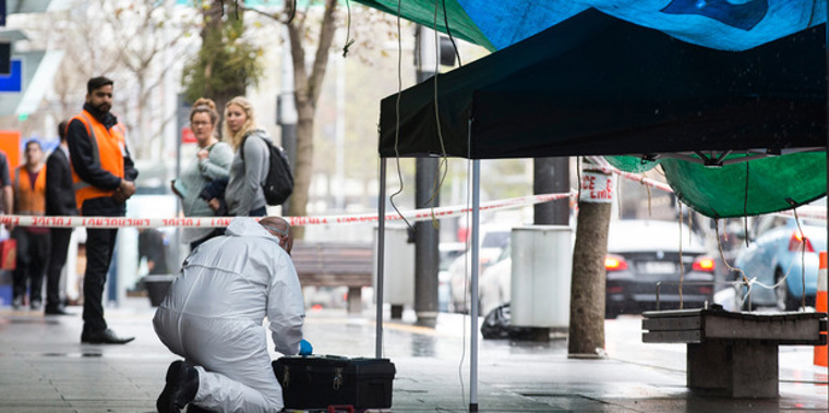 Police and forensics at the scene of a cordon on Queen St. New Zealand Herald Photograph by Jason Oxenham.
