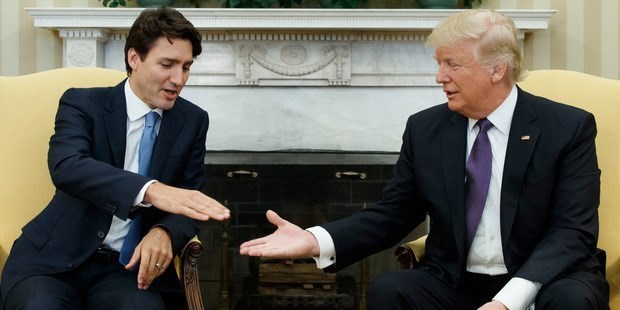 FEBRUARY 13: WHO - Canadian Prime Minister Justin Trudeau. DISCUSSED - Trade, immigration and defence. AWKWARD MOMENT - In a photo that later went viral Trump is shown extending a hand to Trudeau, while Trudeau seemingly declines with a quizzical and mildly disgusted expression on his face.