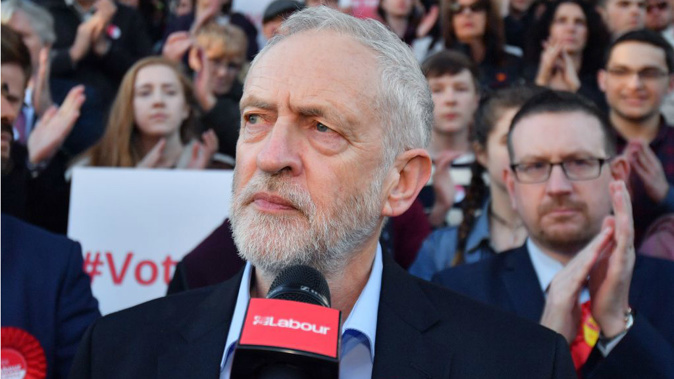 Labour party leader Jeremy Corbyn speaks during a Momentum rally outside Manchester Central. (Getty)