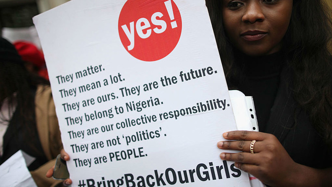 A woman holds a placard during a London protest calling for the release of abducted Nigerian schoolgirls. (Getty)
