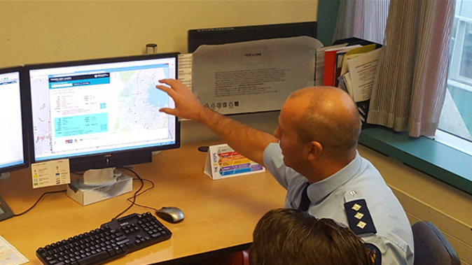 A police officer demonstrates that 111 calls can now be located (Felix Marwick)