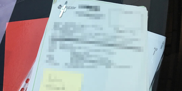 An incident file which was left on the dashboard of a police car, revealing the name and address of a sexual assault victim. Photograph supplied