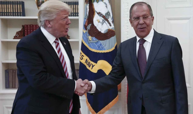 President Donald Trump (L) shaking hands with Russia's Foreign Minister Sergei Lavrov on May 10 (Getty Images) 