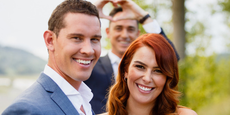 The Bachelor's winning couple Zac Franich and Viarni Bright, with host Dominic Bowden in the background. (NZH)