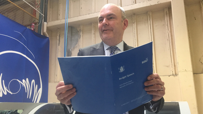 Steven Joyce at the printers on Tuesday with today's Budget (Gia Garrick).