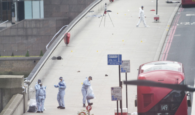 Forensic officers search for evidence across London Bridge (Getty Images) 