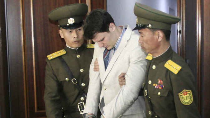 American student Otto Warmbier, centre, is escorted at the Supreme Court in Pyongyang, North Korea in March last year. Photo / AP