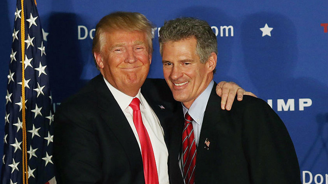 Republican Presidential candidate Donald Trump hugs former Massachusetts senator Scott Brown. (Photo \ Getty Images)
