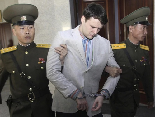 American student Otto Warmbier, center, is escorted at the Supreme Court in Pyongyang, North Korea. Photo / AP