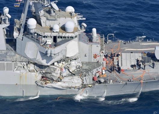Seven crew members are reportedly missing and one injured after a US Navy destroyer collided with a merchant ship off the coast of Japan. (AP)
