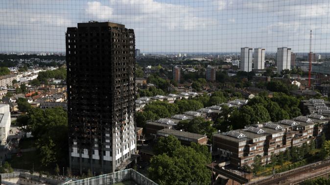 The remains of Grenfell Tower stand in London. Photo / AP