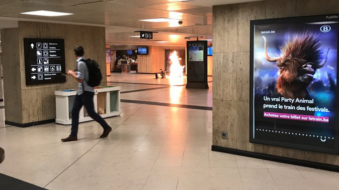A photo on Twitter purports to show an explosion at Brussels central station. Photo @remybonnaffe Twitter