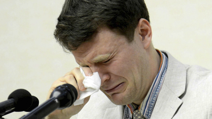 Otto Warmbier cries while speaking to reporters in Pyongyang, North Korea. Photo / AP