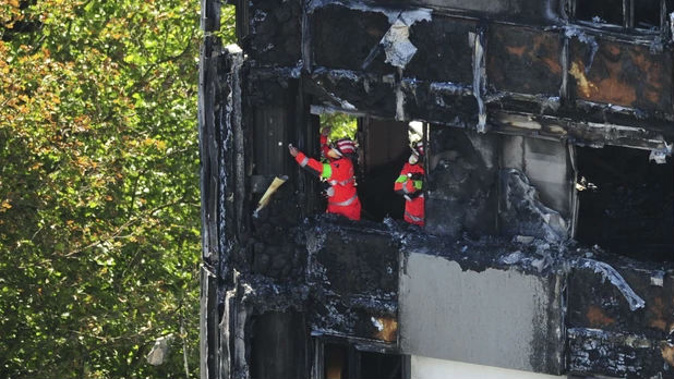 Urban Search and Rescue officers from London Fire Brigade inside the Grenfell Tower. (Photo \ AP)