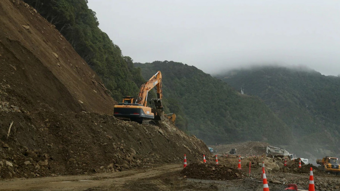 Work on clearing slips north of Kaikoura has reached the half-way mark. (Photo \ NZ Herald)