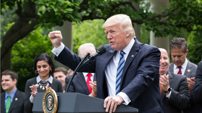 President Donald Trump was whisked a few blocks from the White House to the Trump hotel for his first re-election fundraiser (Getty Images)