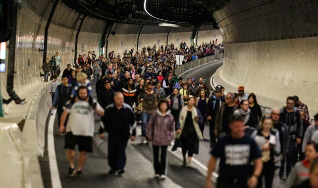 Members of the public walk through the Waterview tunnel (Getty Images) 