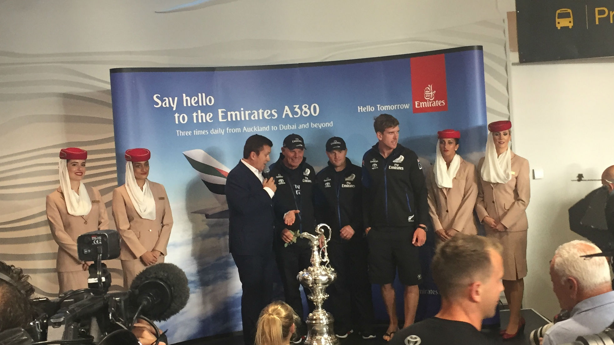 Members of Team NZ with the America's Cup at Auckland Airport (Photo / Vaimoana Tapaleao).