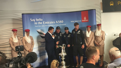Members of Team NZ with the America's Cup at Auckland Airport (Photo / Vaimoana Tapaleao).