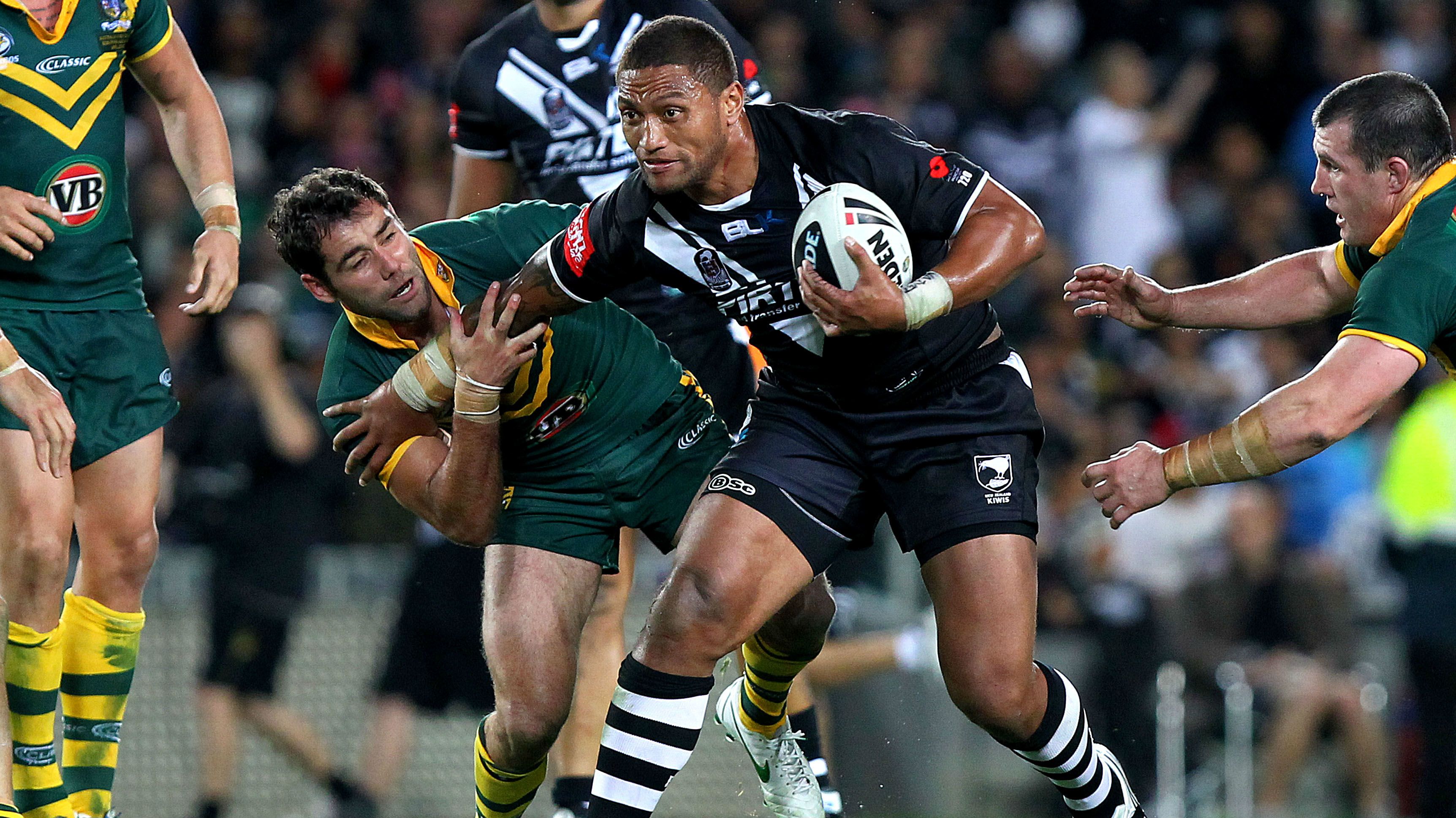 Kiwis' Manu Vatuvei fends off Kangaroos' Cameron Smith. Anzac Rugby League test match, New Zealand Kiwis v Australia Kangaroos at Eden Park, Auckland, New Zealand. Friday 20th April 2012. Photosport.