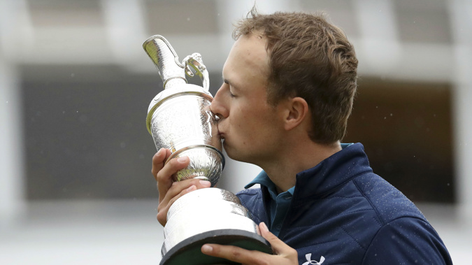 Jordan Spieth of the United States kisses the trophy after winning the British Open. Photo / AP