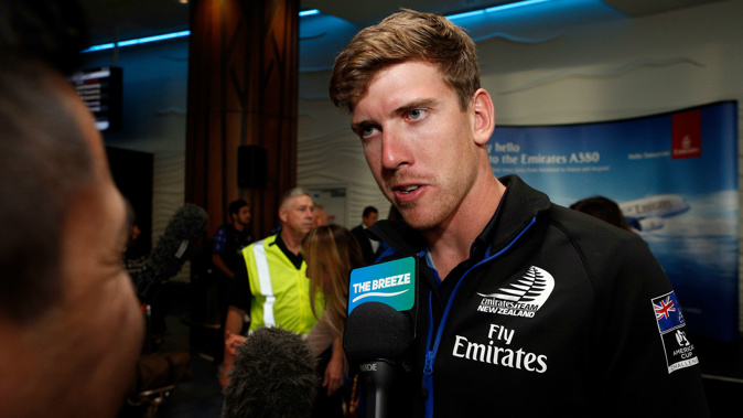 Peter Burling speaks to media at Auckland Airport. Photosport.