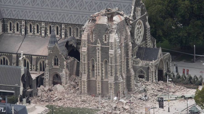 The partially collapsed Christ Church Cathedral on the evening of the February 22, 6.3-magnitude, Christchurch earthquake. (Photo / Mark Mitchell)