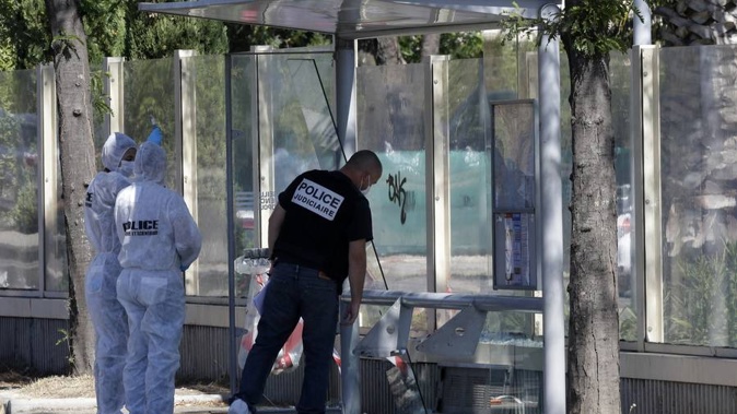 Policce officers inspect a bus stop in La Valentine district after a van rammed into two bus stops in the French port city of Marseille, southern France. (Photo / AP)