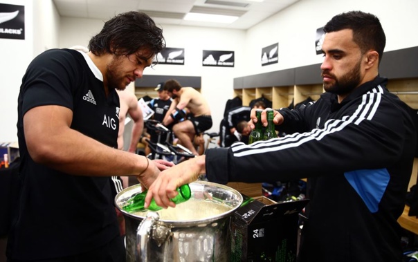 All Blacks Steven Luatua and Liam Messam fill the Bledisloe Cup with the sponsor's product (Getty Images) 
