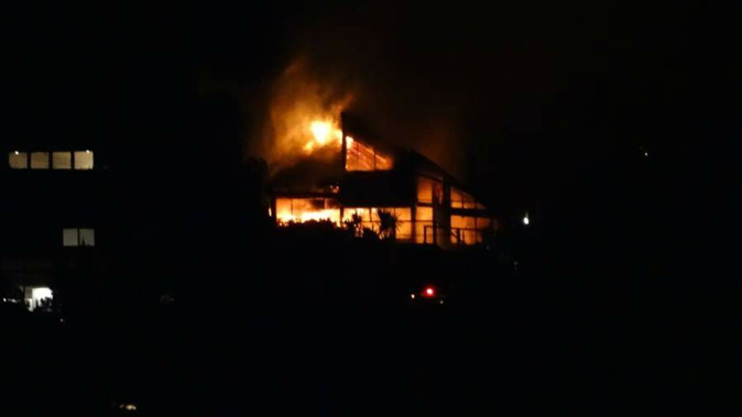 The house on Clifton Terrace in Sumner went up in flames around 8.30pm. (Photo \ Supplied)