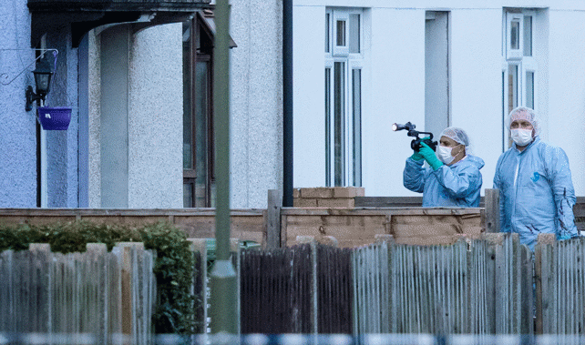 Forensic experts investigate the property (Getty Images)