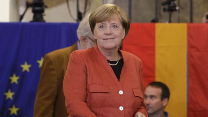 German Chancellor Angela Merkel casts her vote in Berlin, Germany. (Photo / AP)