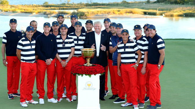 US President Donald Trump poses with the victorious United States team (Getty)