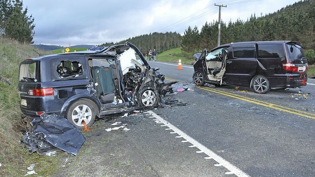The wreckage of two cars involved in the crash, which police are describing as the worst they've seen in 20 years. (Photo / John van de Ven)