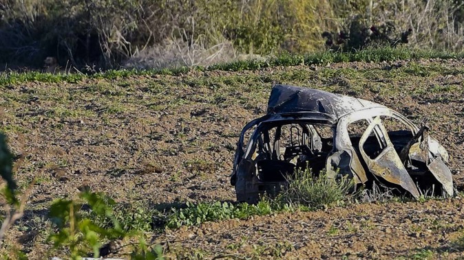 The wreckage of the car of investigative journalist Daphne Caruana Galizia lies next to a road in the town of Mosta, Malta yesterday. (Photo / AP)