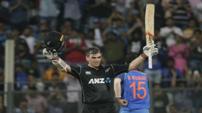 New Zealand's Tom Latham raises his bat after scoring his fourth ODI ton. (Photo / AP)