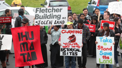 Two groups converged on Auckland Museum to protest the company. Photo/NZ Herald