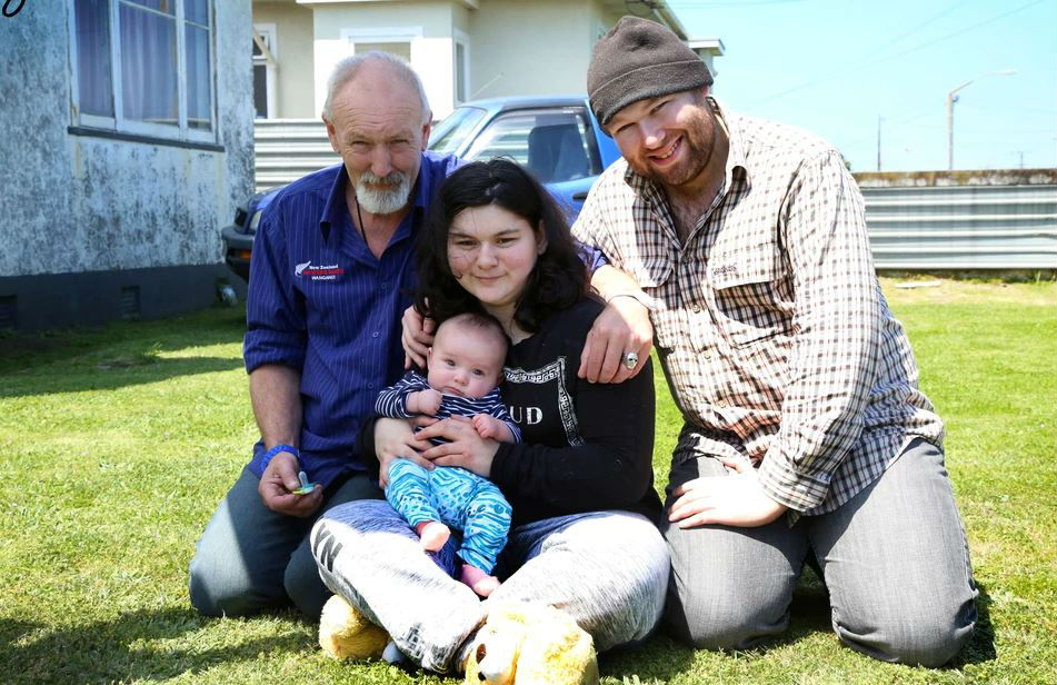 Grandfather Brian Maisey with mother Freyja and father Laurence happy to have baby Charlie home. Photo/ Stuart Munro