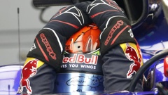 Toro Rosso driver Brendon Hartley adjusts his helmet siting in his car in the pit lane. (Photo / AP)