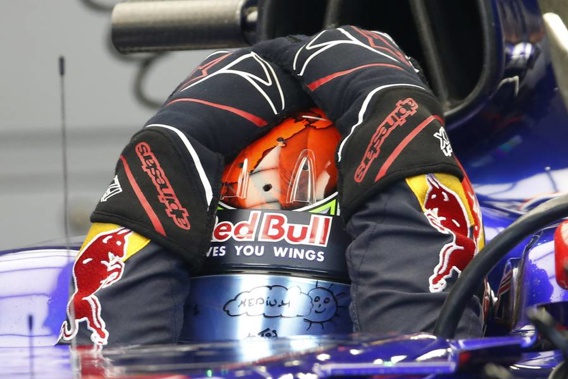 Toro Rosso driver Brendon Hartley adjusts his helmet siting in his car in the pit lane. (Photo / AP)
