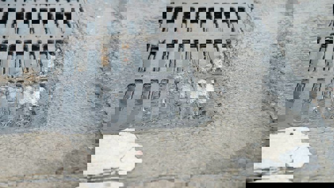 The teen was dragged to a nearby water drain and his head held under water. (Photo \ File)