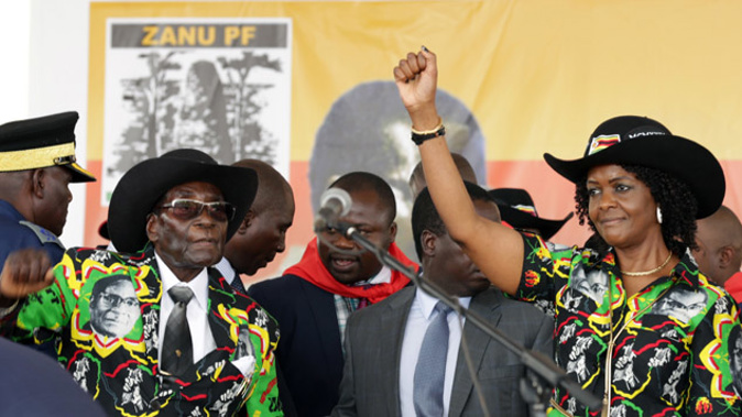Grace Mugabe, right, with her husband, Zimbabwean President Robert. Photo/Getty