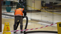 Contractors clean up food oil spill at Elliott food court in Auckland.