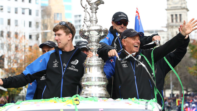 Peter Burling, Grant Dalton and Glenn Ashby celebrate with the Americas Cup. (Photo \ Getty Images) 
