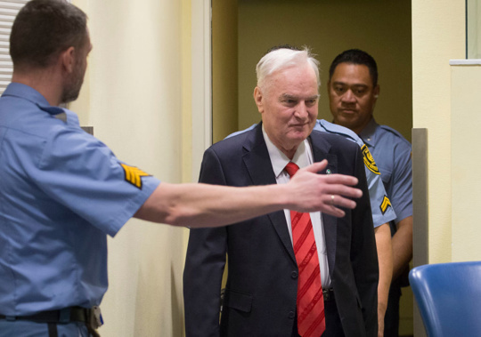Former Bosnian military chief Ratko Mladic appears in the International Criminal Tribunal charged with genocide, war crimes and crimes against humanity. (Photo \ Getty Images)